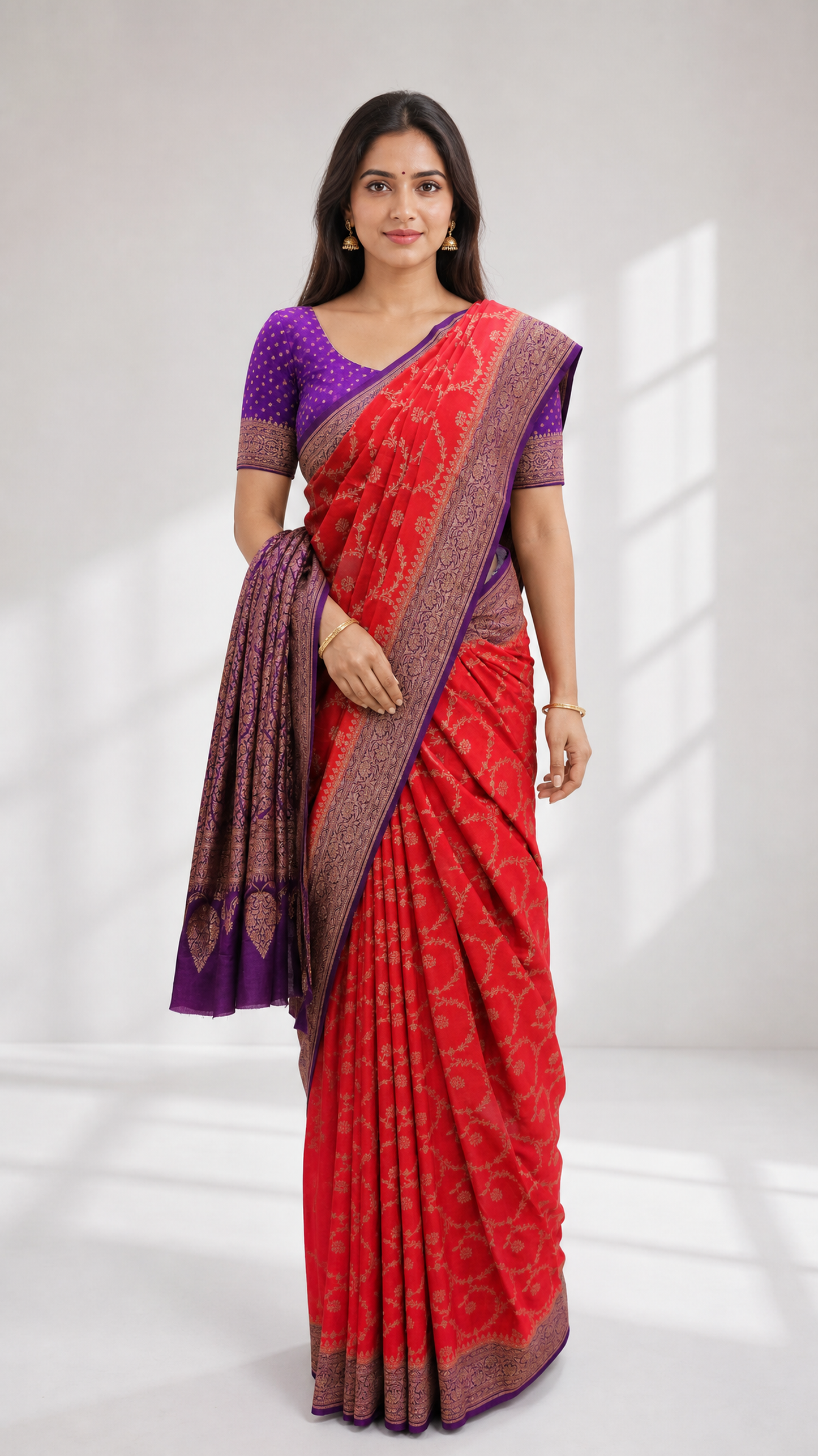 woman wearing red banarsasi crepe saree with purple zari border and blouse