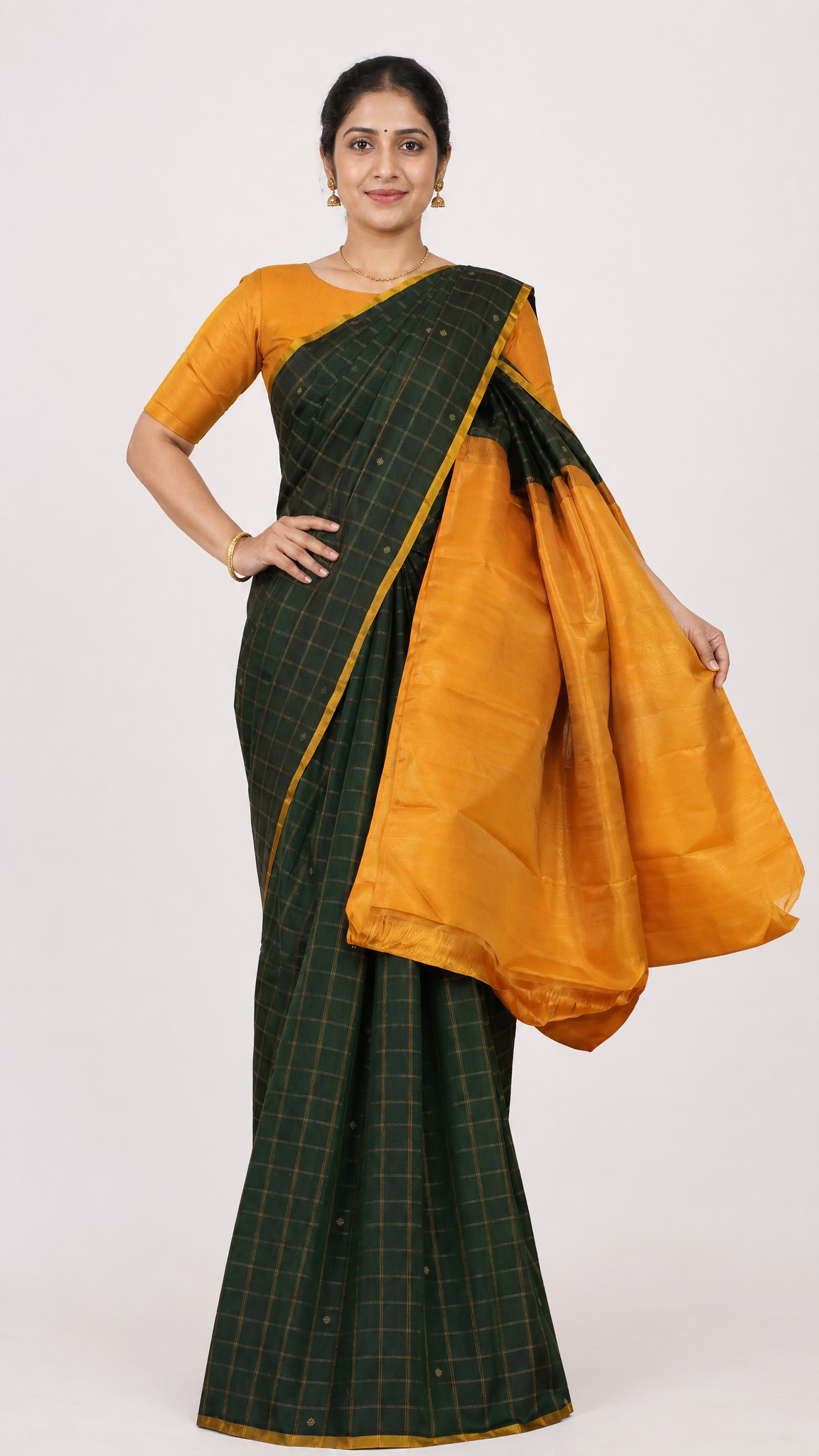 green and orange silk saree with gold check pattern and contrasting border