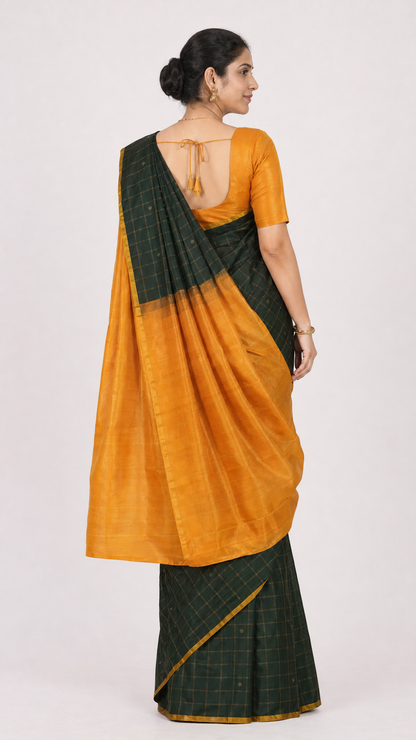 Green check saree with orange pleated pallu, gathered drape and gold border detail