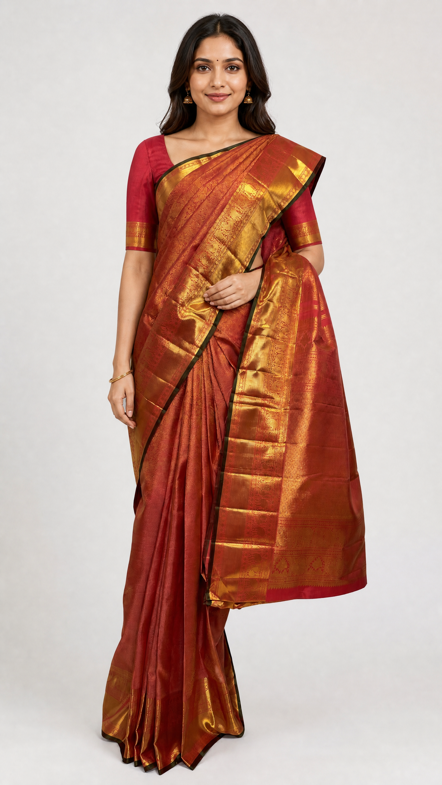 woman wearing heavy red brocade kanjivaram silk saree with peacock and elephant motifs