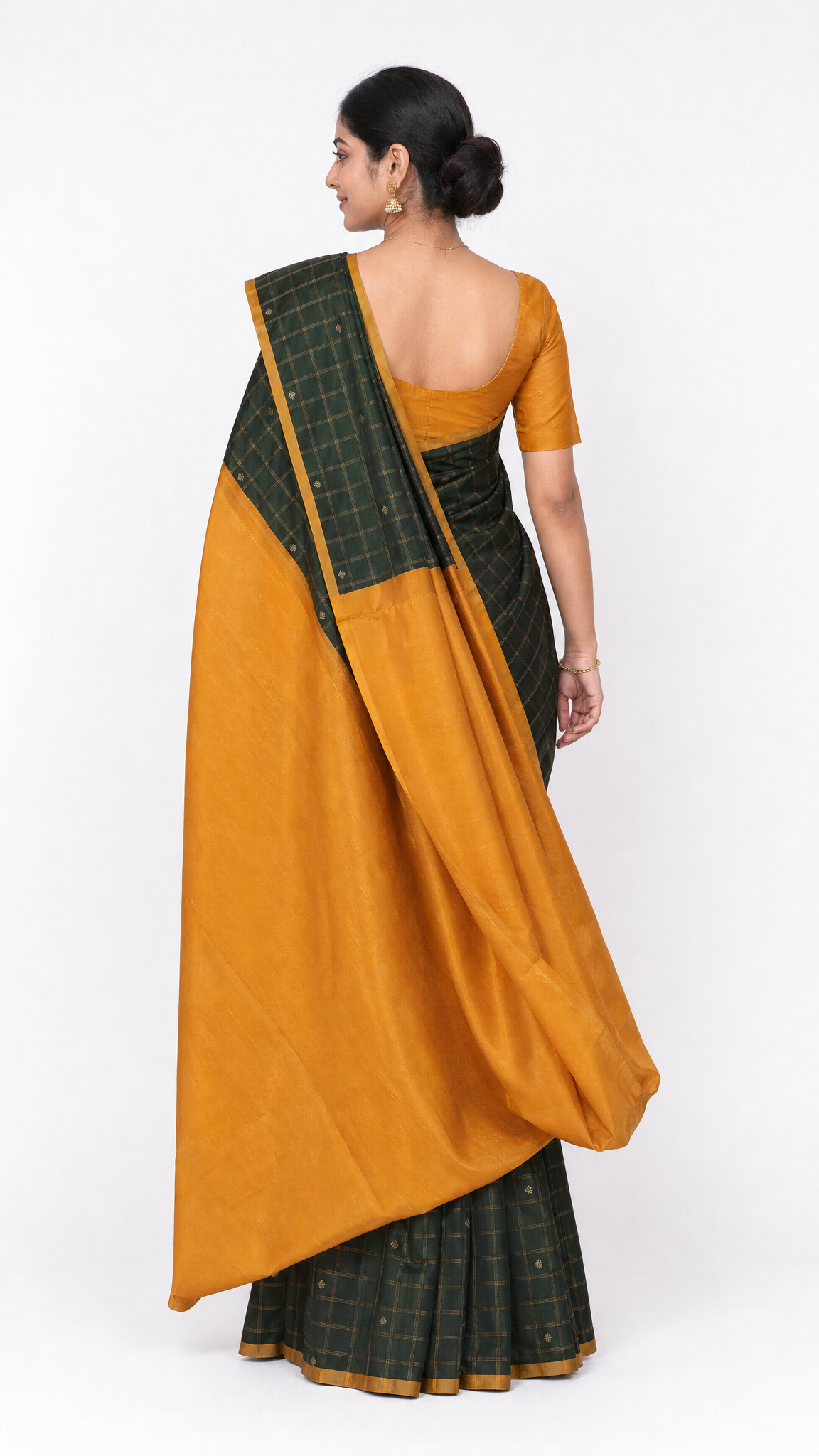 kanjeevaram silk saree with mustard back drape and dark green checkered pallu