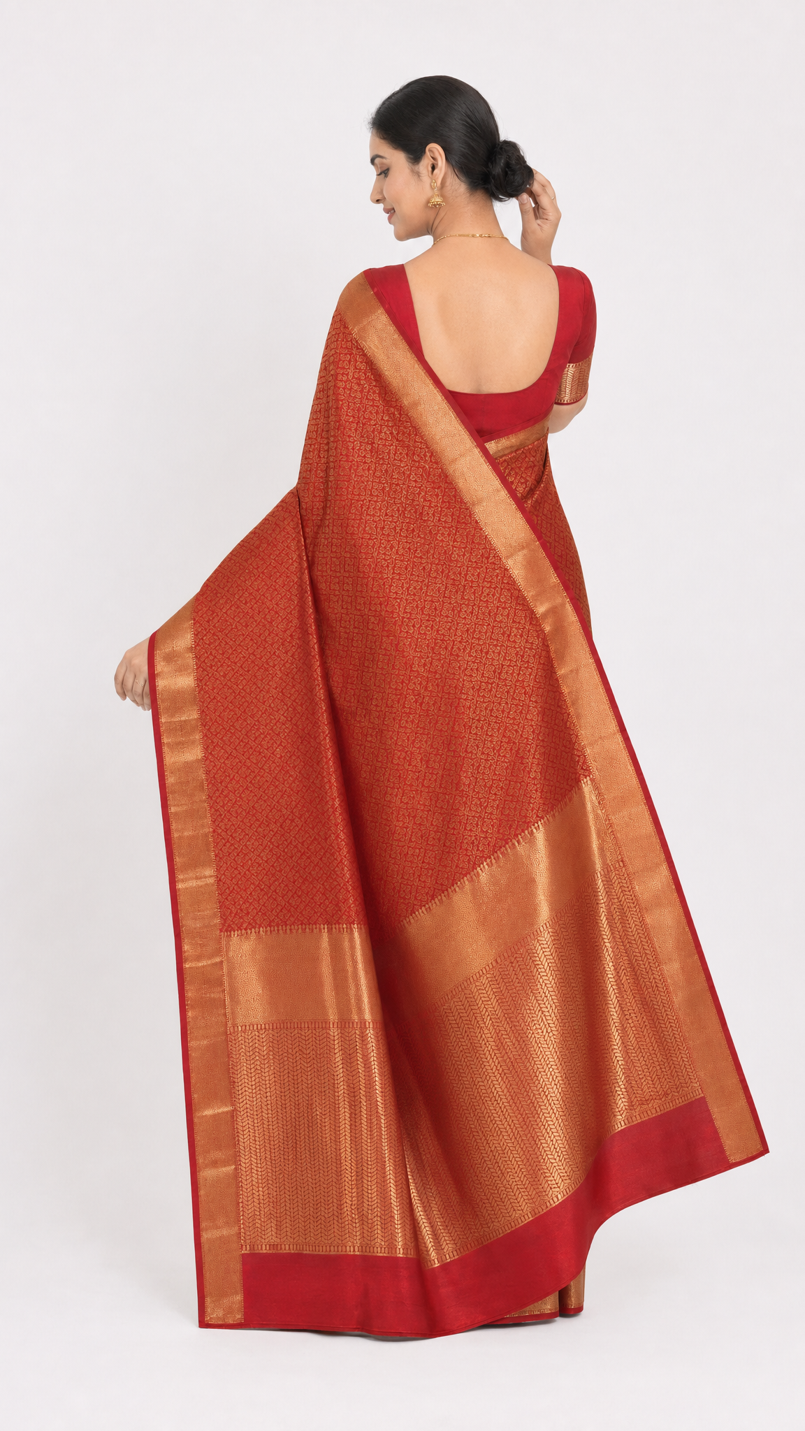 Red and gold silk saree with gold pallu border shown from the back