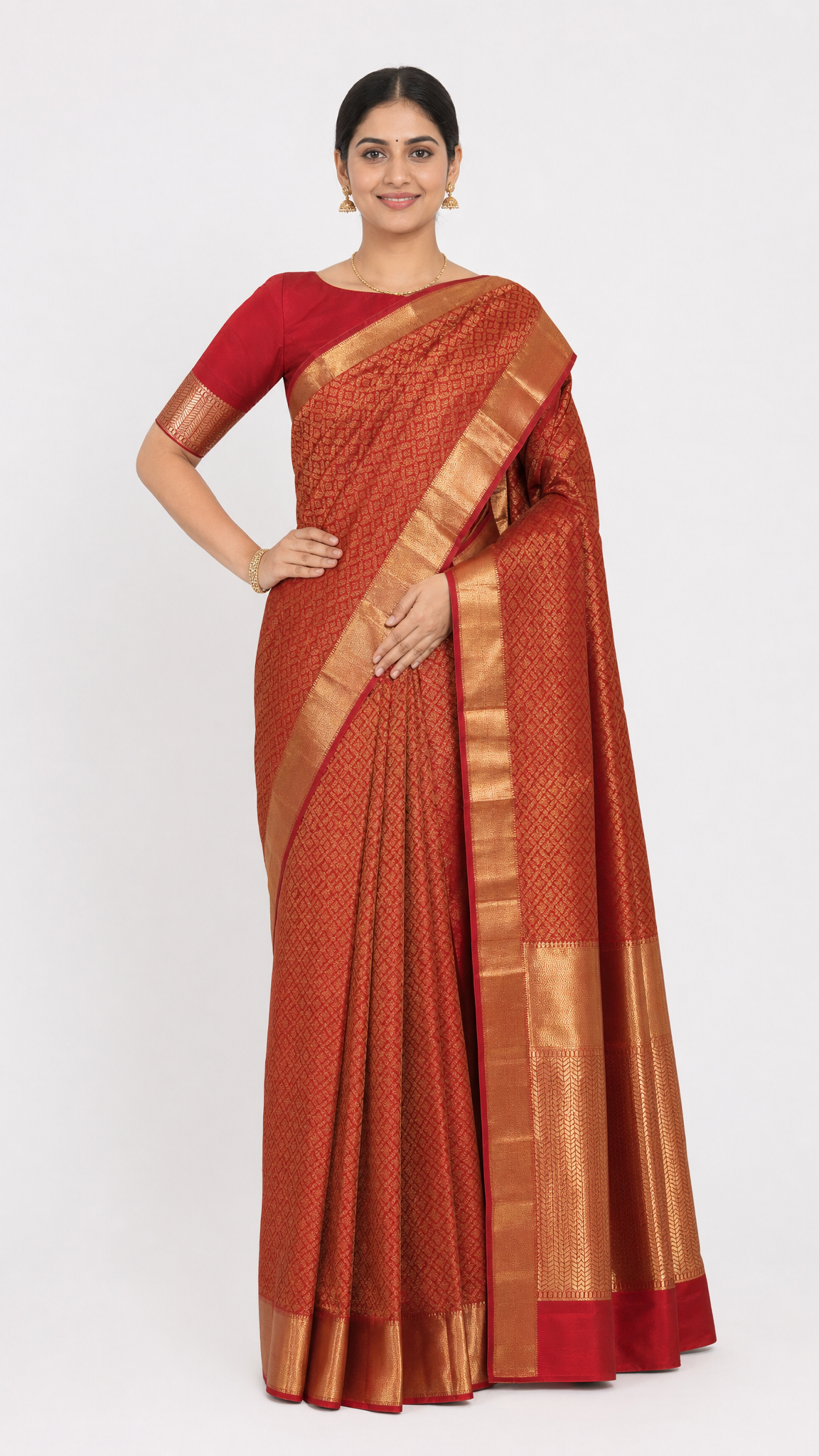 red and gold silk wedding saree with wide gold border and draped pallu